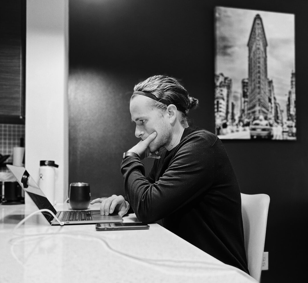 Argentine creative director reviewing layouts in a minimalist office